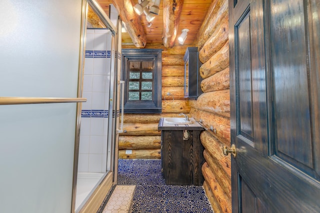 bathroom featuring beam ceiling, log walls, walk in shower, vanity, and wood ceiling