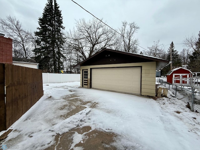 view of snow covered garage