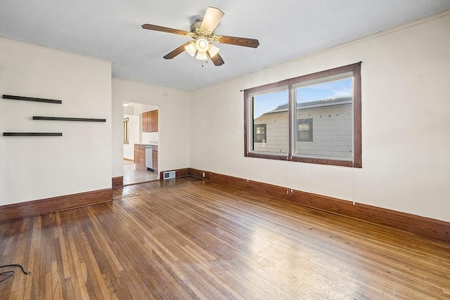 unfurnished living room featuring hardwood / wood-style floors and ceiling fan