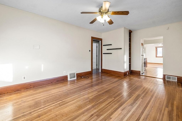 unfurnished room with wood-type flooring and ceiling fan