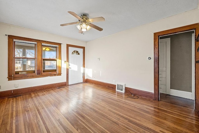 interior space with hardwood / wood-style floors and ceiling fan