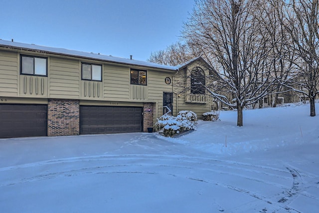 raised ranch featuring a garage