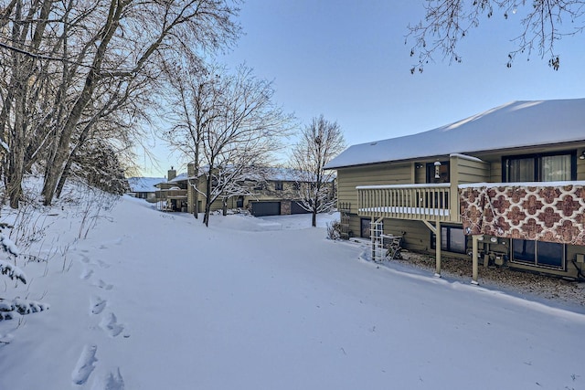 view of yard layered in snow