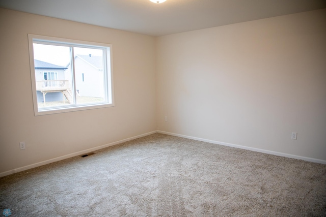 view of carpeted spare room