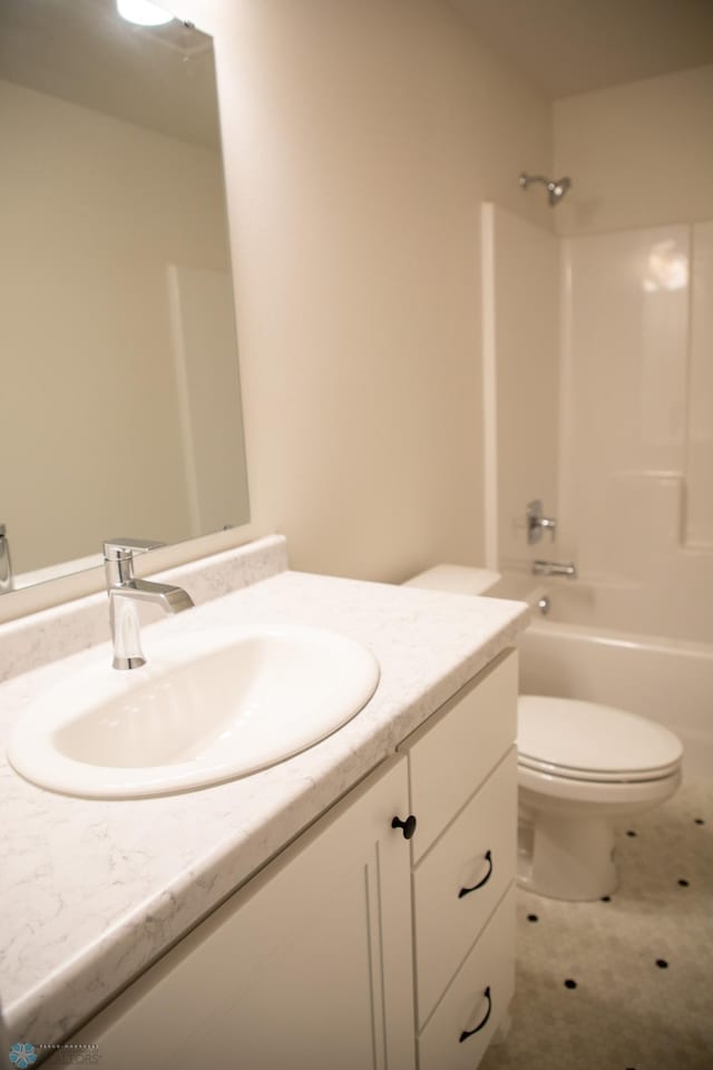 full bathroom with vanity, toilet, and shower / washtub combination