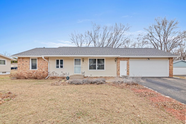 ranch-style house with a front yard and a garage