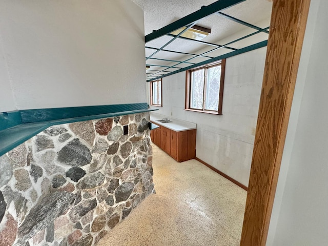 bathroom with vanity and a textured ceiling