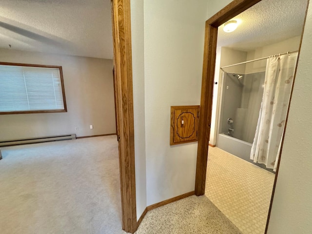 bathroom with shower / bath combination with curtain, a textured ceiling, and a baseboard radiator