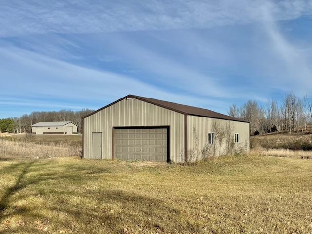 garage with a lawn