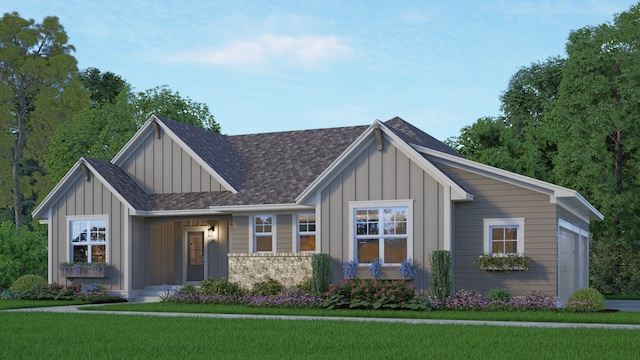 view of front of property with a garage and a front lawn