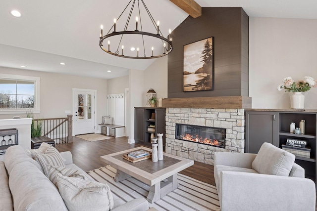 living room featuring high vaulted ceiling, recessed lighting, a fireplace, wood finished floors, and beam ceiling