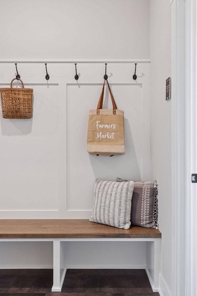 mudroom featuring wood finished floors and baseboards