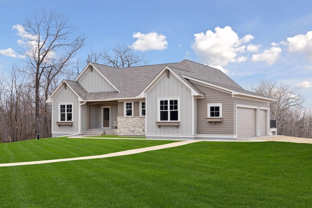 view of front of property with roof with shingles, an attached garage, board and batten siding, driveway, and a front lawn