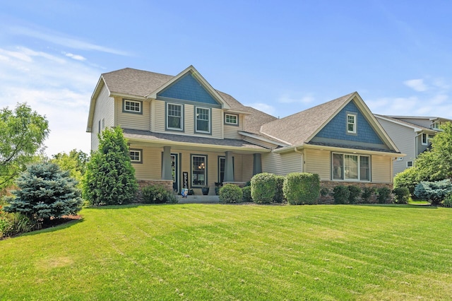 craftsman-style house featuring a front lawn and a porch