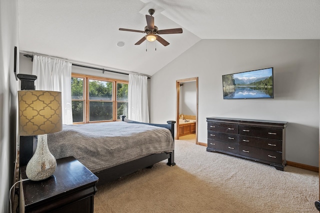 carpeted bedroom featuring connected bathroom, ceiling fan, and vaulted ceiling