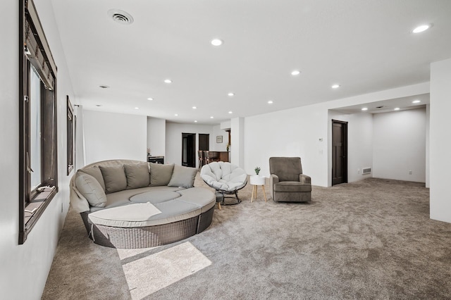 carpeted living room featuring a wealth of natural light