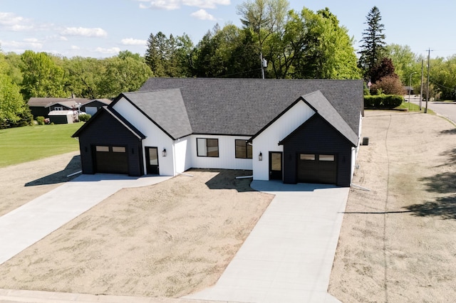 102 3rd Ave, Pelican Rapids, MN 56572 - modern farmhouse featuring driveway, roof with shingles, and an attached garage