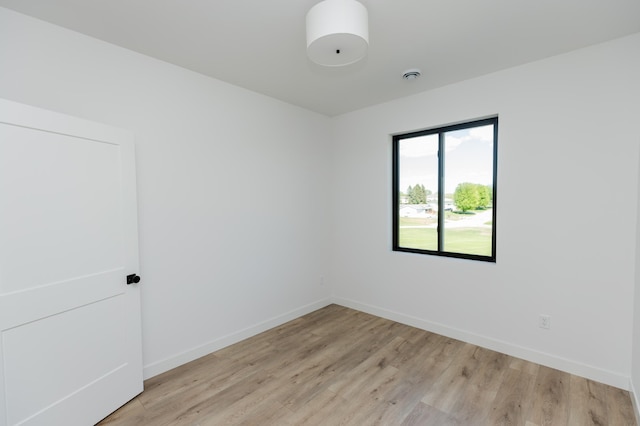102 3rd Ave, Pelican Rapids, MN 56572 - spare room with light wood-type flooring and a smoke detector