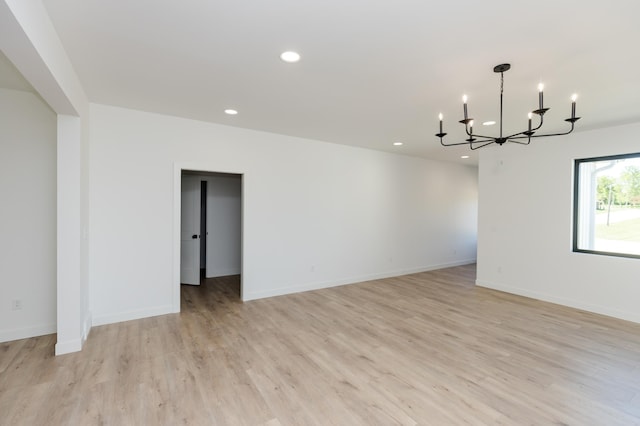 102 3rd Ave, Pelican Rapids, MN 56572 - spare room with a chandelier, recessed lighting, and light wood-style flooring