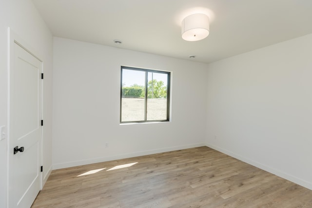 102 3rd Ave, Pelican Rapids, MN 56572 - unfurnished room featuring light wood-style floors and a smoke detector