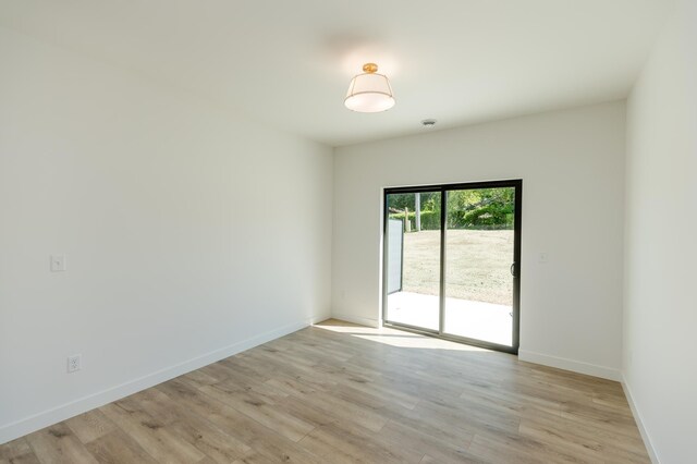 102 3rd Ave, Pelican Rapids, MN 56572 - spare room with light wood-style floors and baseboards