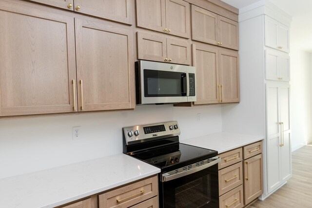 102 3rd Ave, Pelican Rapids, MN 56572 - kitchen with stainless steel appliances and light brown cabinetry