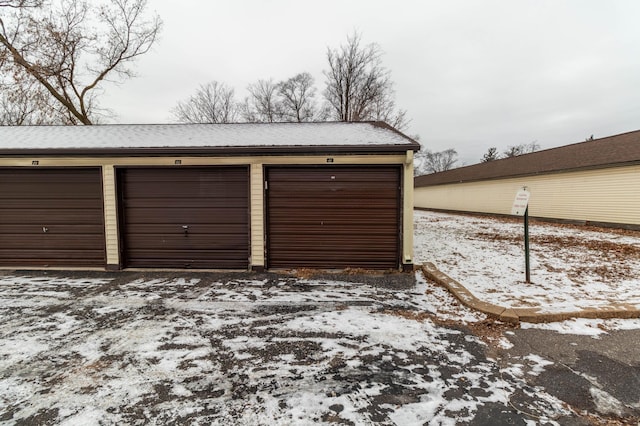 view of snow covered garage