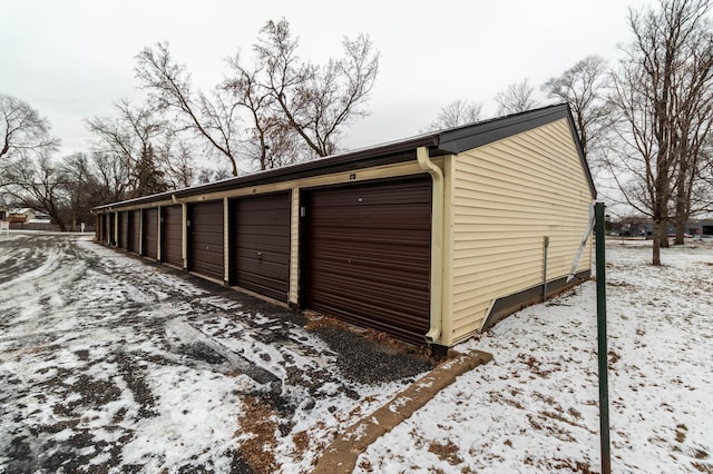 view of snow covered garage