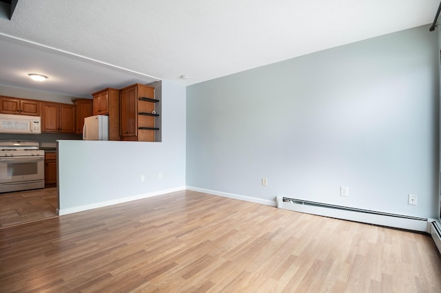 unfurnished living room with light hardwood / wood-style floors, a textured ceiling, and a baseboard radiator