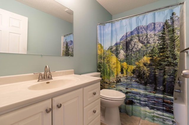 bathroom with tile patterned floors, walk in shower, vanity, a textured ceiling, and toilet