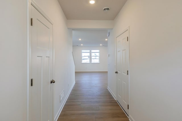 hallway featuring wood-type flooring