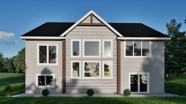 rear view of house with a yard