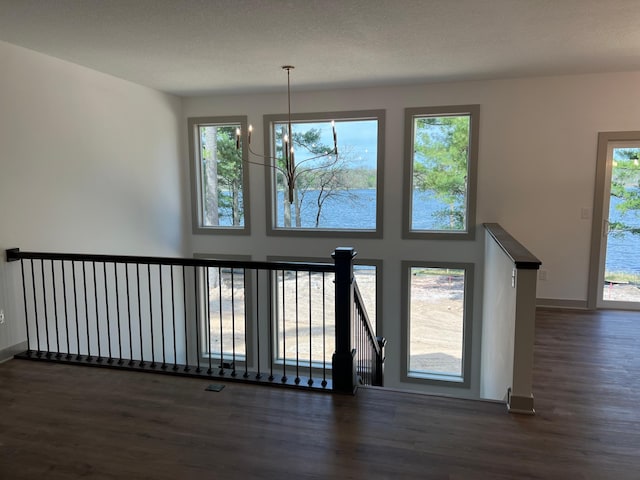 interior space with dark wood finished floors and baseboards