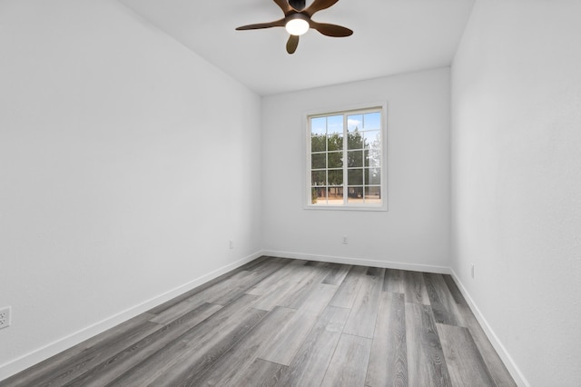 empty room with light wood-type flooring and ceiling fan