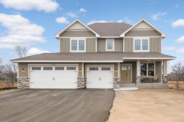 craftsman-style house with a porch and a garage