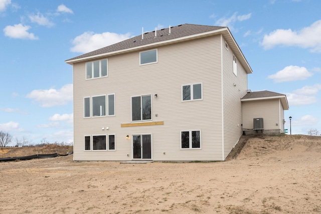 rear view of house with cooling unit