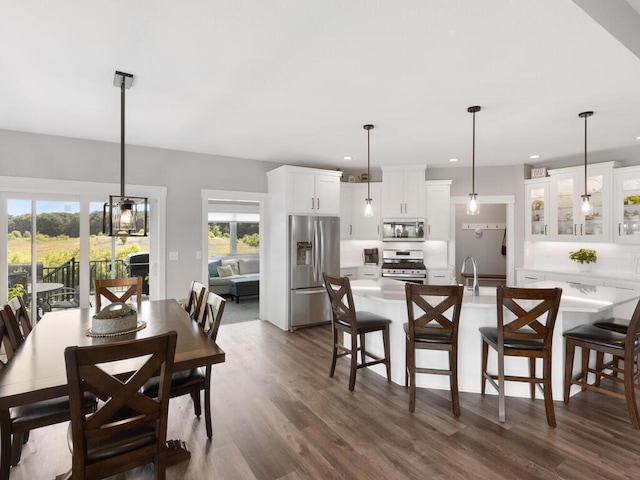 dining area with dark wood-type flooring