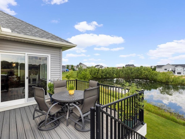 wooden terrace featuring a water view