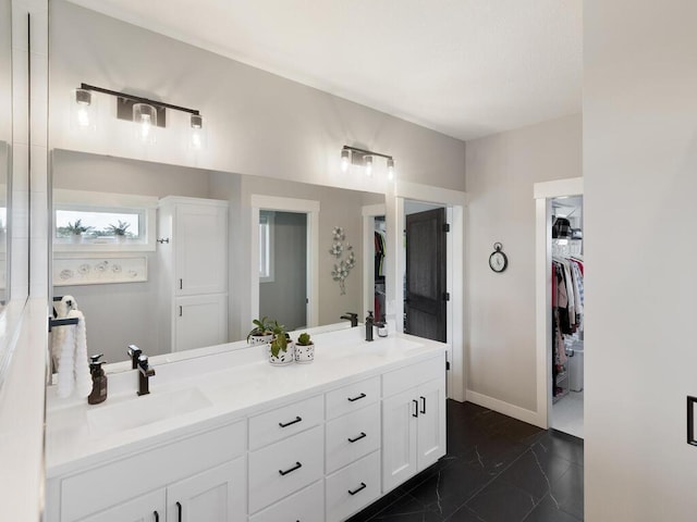 bathroom featuring tile patterned flooring and vanity