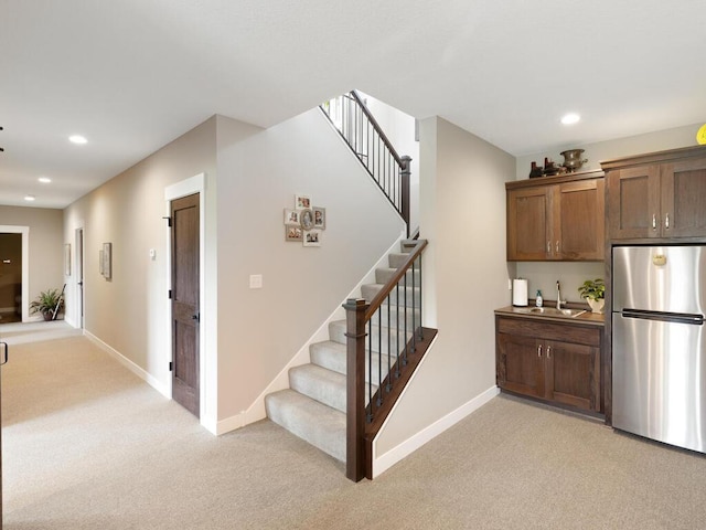 interior space featuring sink and carpet