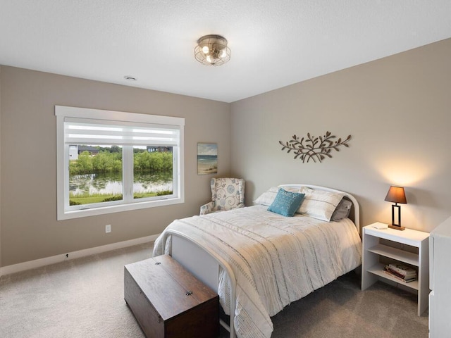 bedroom featuring dark colored carpet