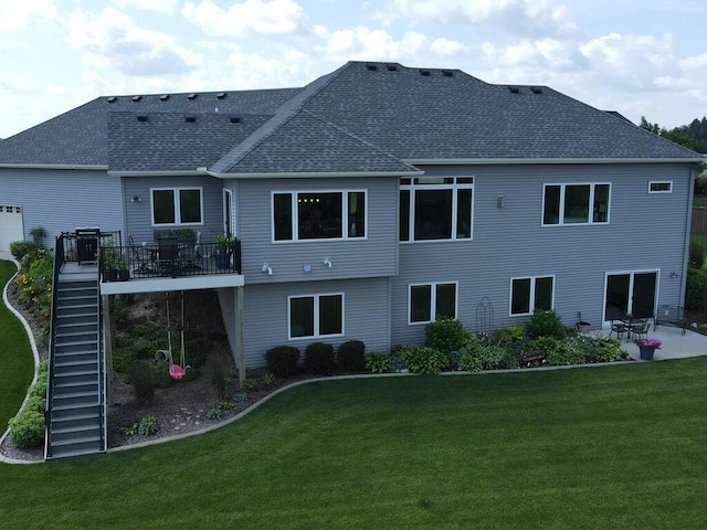 back of house featuring a patio and a yard