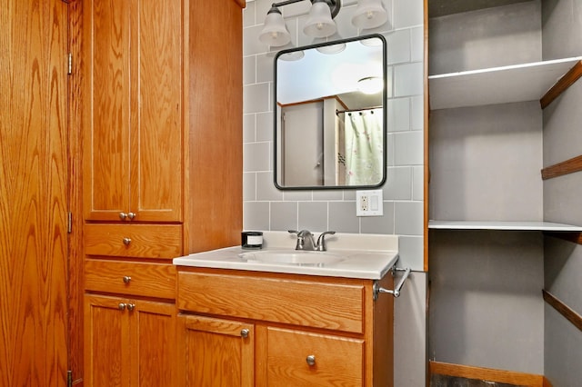 bathroom with decorative backsplash and vanity