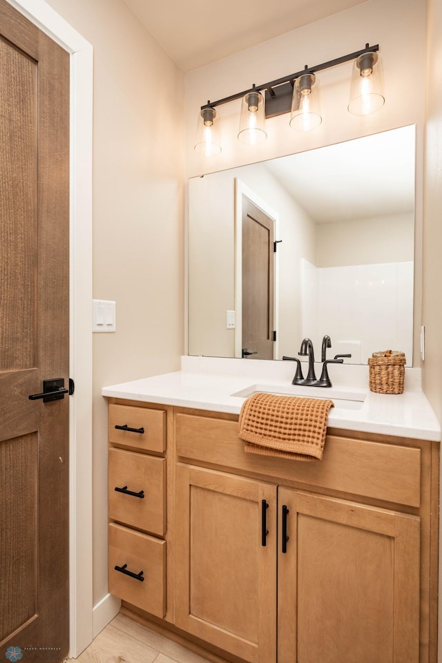 131 Pine Ave, Mapleton, ND 58059 - bathroom featuring vanity and wood finished floors