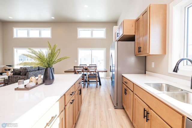 131 Pine Ave, Mapleton, ND 58059 - kitchen with a sink, light brown cabinetry, freestanding refrigerator, light countertops, and recessed lighting