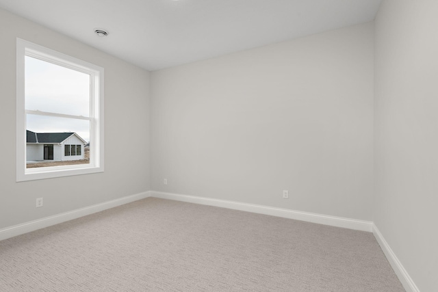 spare room with carpet flooring