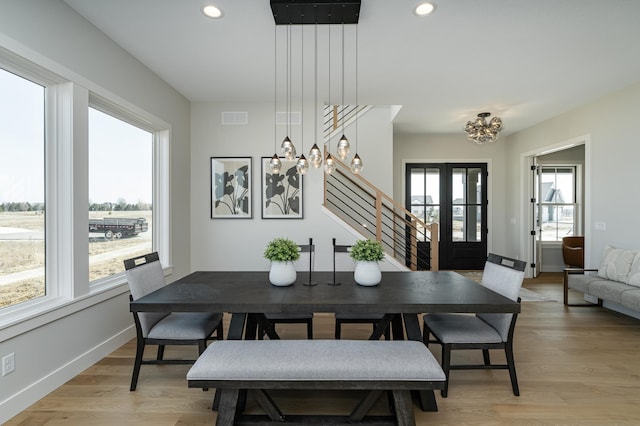 dining area with stairway, visible vents, baseboards, recessed lighting, and light wood-type flooring