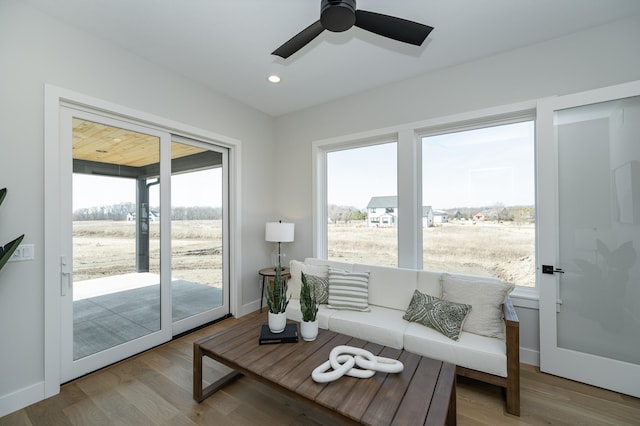 living area featuring a ceiling fan, recessed lighting, wood finished floors, and baseboards