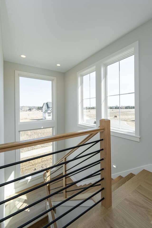 staircase with recessed lighting and baseboards