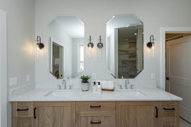 full bathroom featuring a sink and double vanity